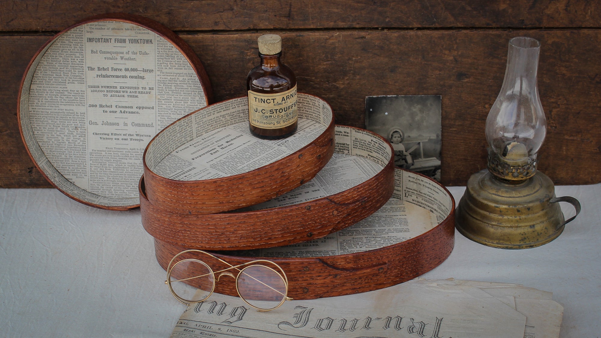 Set of handcrafted Shaker-style oval trays with antique newspaper linings from the Civil War era